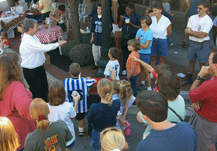 Festival Magician Chaz Misenheimer performs Street Magic